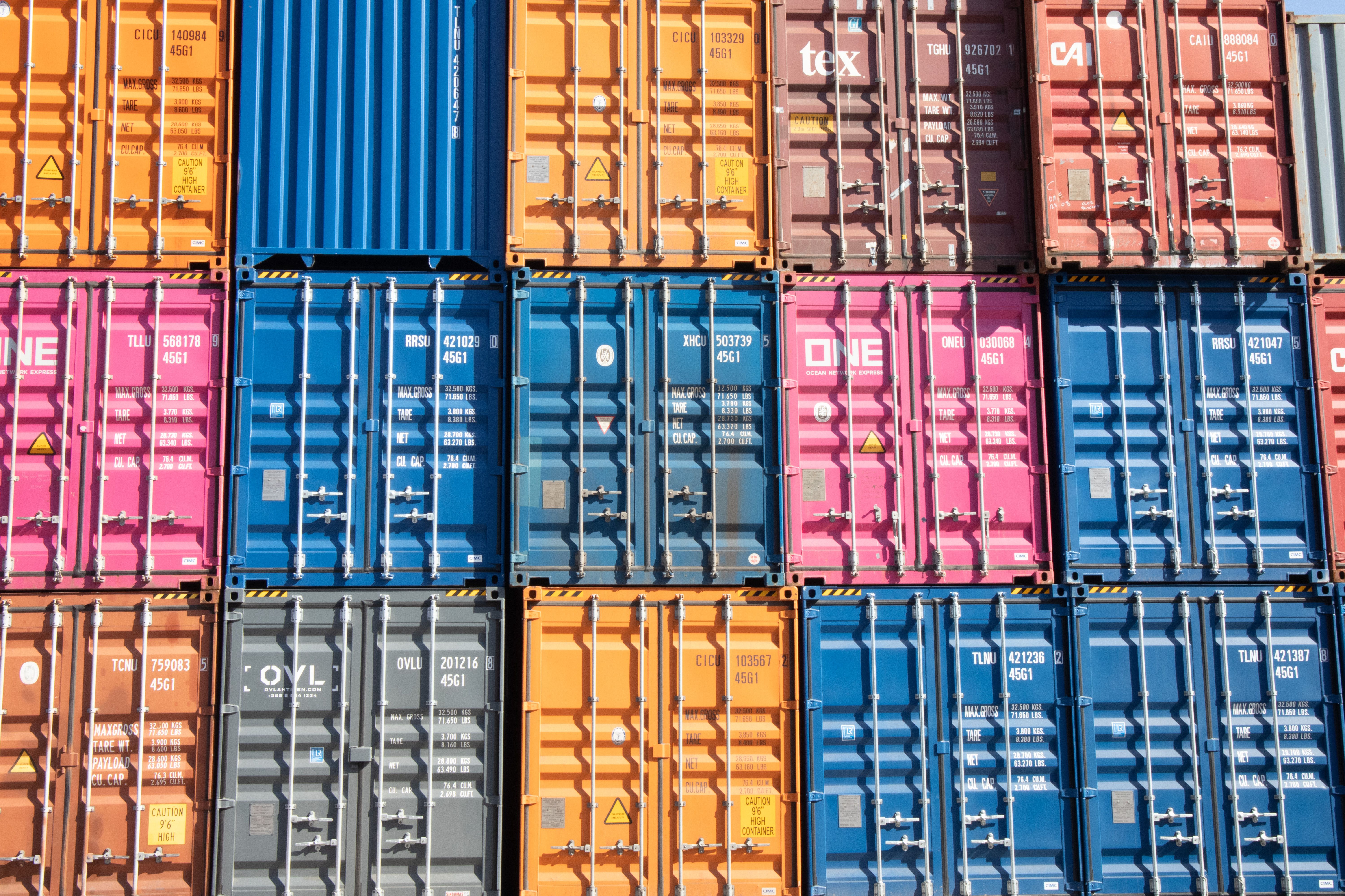 Colourful shipping containers stacked at a cargo port