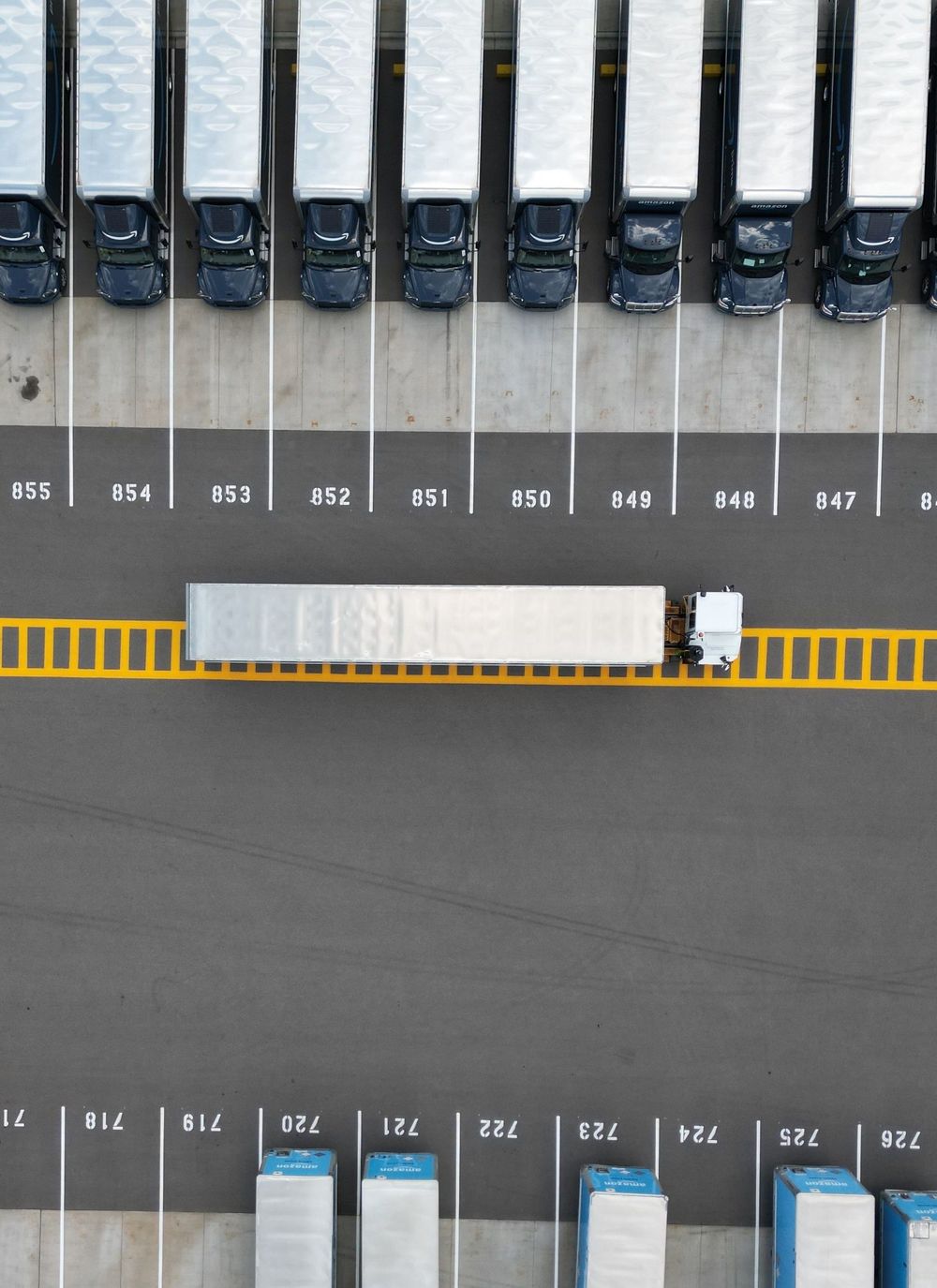Cargo containers stacked vertically at port